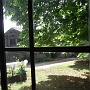 View of front garden through the doors of the barn
